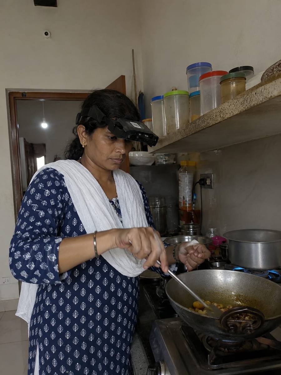 Woman cooking at home wearing a head-mounted camera
